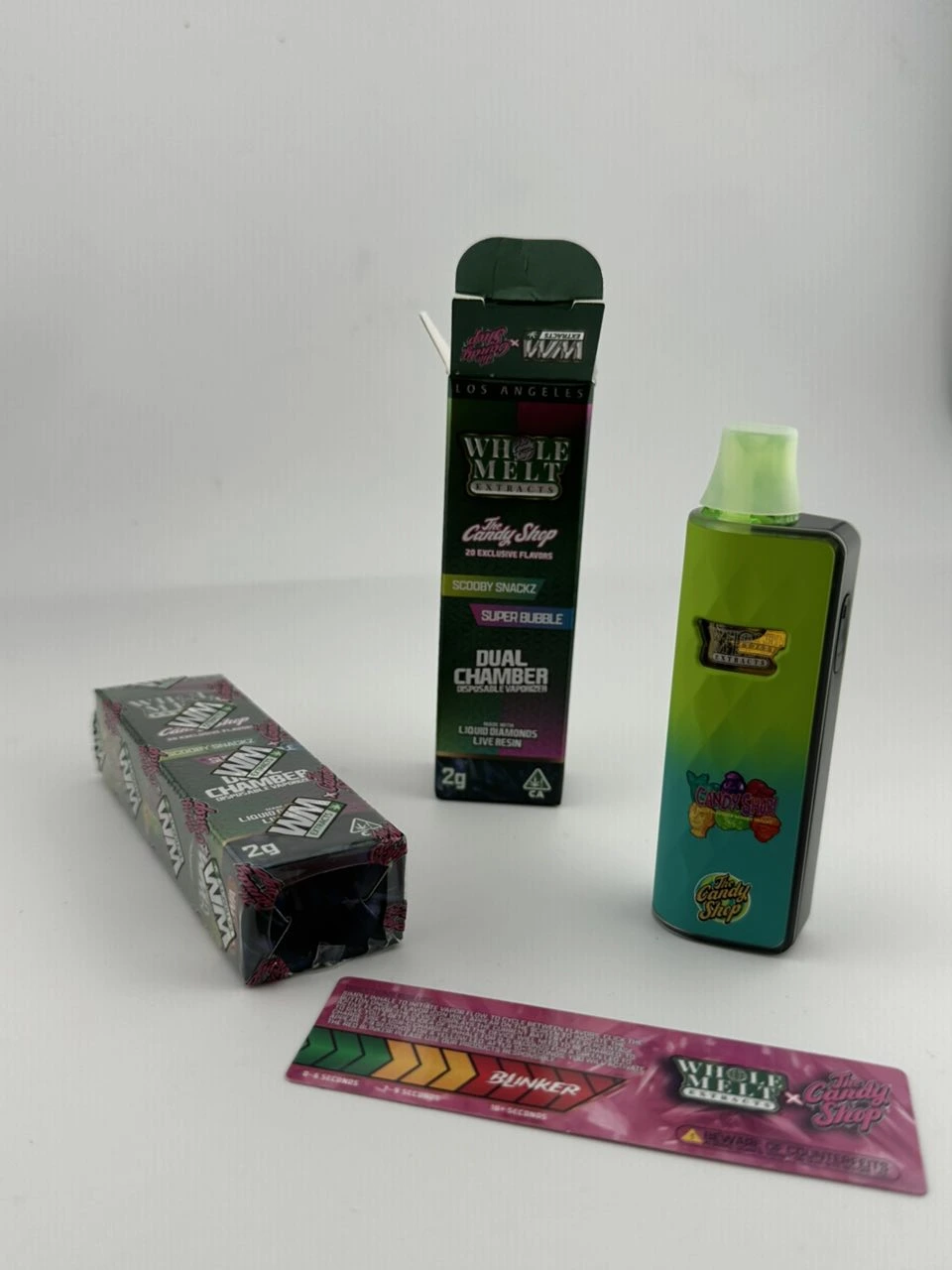 Whole Melts 2g disposable device beside its box